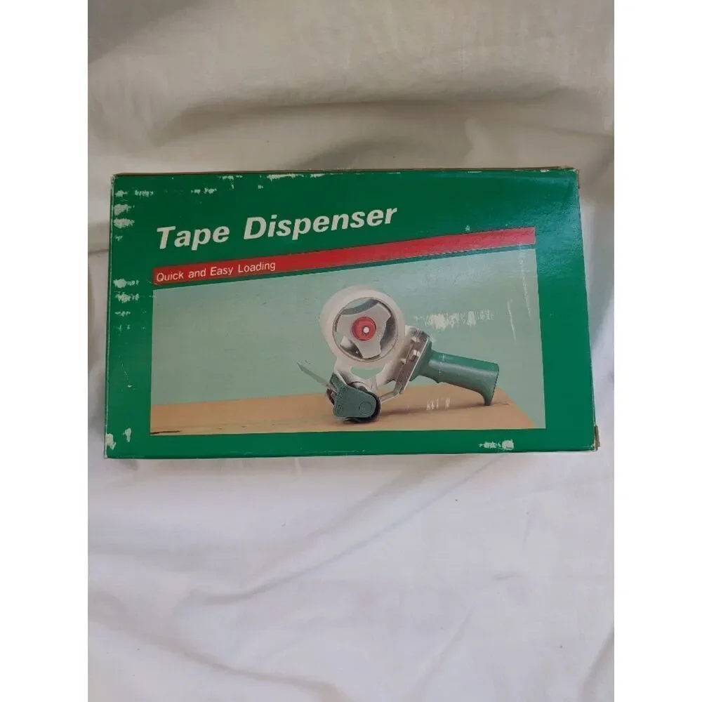Packing Tape Dispenser. BRAND NEW. NEVER USED. COMES IN ORIGINAL BOX